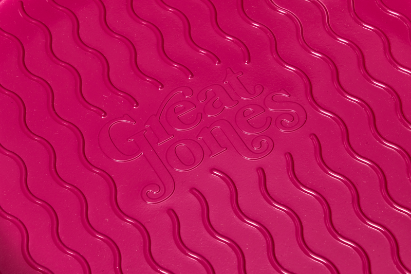 Great Jones | Patty Cake - Broccoli with a wavy, corrugated design, ideal for easy release and even baking, showcased in a close-up of its textured surface.