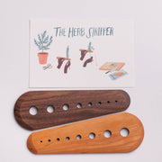 Collin Garrity - Herb Stripper: Maple (Limited-release) features a paddle with holes for stripping herb leaves, shown with an instruction card detailing its use.