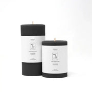 Mo&Co Home - 100% Beeswax Pillar Candles, Charcoal: Two hand-poured, black pillar candles with wood wicks and labels, ideal for eco-friendly home decor.