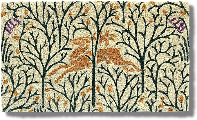 Entryways | Victoria and Albert Museum Doormat, Deer in the Forest, 18 x 30: A woodland-themed coir mat depicting a leaping deer amid stylized trees and leaves.