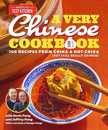 Cover of A Very Chinese Cookbook by Kevin and Jeffrey Pang, featuring a dumpling in chili oil, with author photos, blending recipes and personal stories.