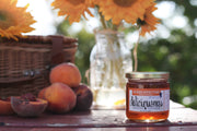 RedCamper - Colo. Whiskey Peach Deliciousness Preserves, 9 oz jar, ideal for cheeseboards. Made with organic peaches, Laws Whiskey, and Madagascar vanilla. Perfect for pairing with various foods.