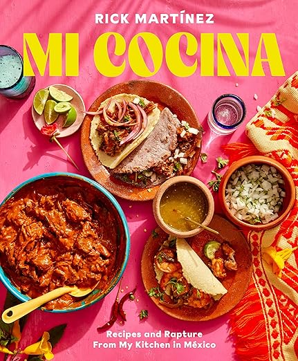 Cover of Mi Cocina: Recipes and Rapture from My Kitchen in Mexico cookbook featuring Mexican dishes like saucy meat and tortillas with sides, by Rick Martínez.