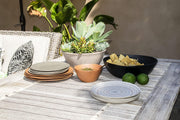 TarHong | Planta Matte Dinner Plate - Black, displayed in a stack, showcases its organic edges and durable, ceramic-like finish, ideal for stylish indoor or outdoor dining.