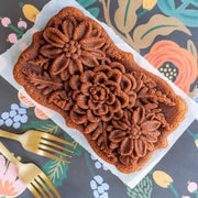 Nordic Ware | Wildflower Loaf Pan with detailed floral carvings, showcasing intricate fern and flower designs for elegant bread presentations.