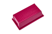 Great Jones | Breadwinner - Raspberry loaf pan with a wavy, nonstick bottom, perfect for baking. Features nontoxic ceramic coating and embossed design.