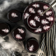 Nordic Ware | Skull Cakelet Pans - Skull Bites featured with a spooky punch setup, showcasing ice cubes molded into skull shapes for Halloween-themed gatherings.