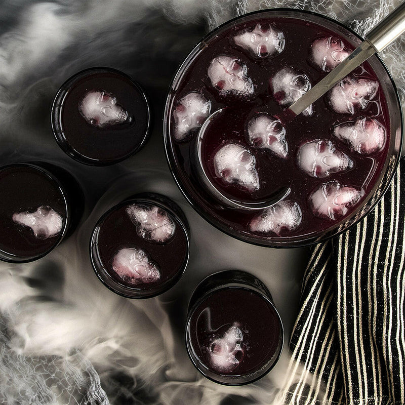 Nordic Ware | Skull Cakelet Pans - Skull Bites featured with a spooky punch setup, showcasing ice cubes molded into skull shapes for Halloween-themed gatherings.