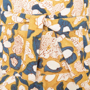 Couleur Nature - Forest Harvest Mustard & Blue Apron detail with self-fabric tie and pocket, featuring hand-printed abstract floral design inspired by Provençal forests.