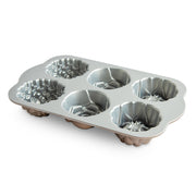 Nordic Ware | Floral Cakelet Pan with six molds for mini Bundt® cakes, featuring three floral designs, crafted from durable cast aluminum for even baking.