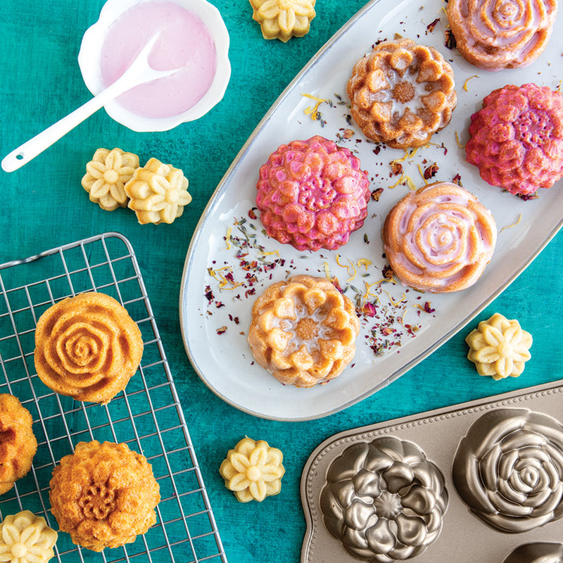 Nordic Ware | Floral Cakelet Pan featuring intricate flower-shaped molds, ideal for crafting mini Bundt® cakes. Perfect for special occasions or elegant home baking.