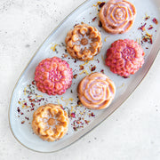 Nordic Ware | Floral Cakelet Pan featuring intricate floral shapes for mini Bundt® cakes, ideal for special events and crafted for even baking and easy release.