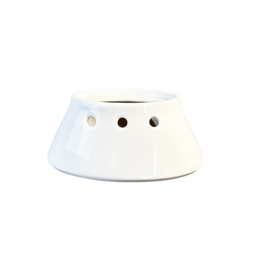 Pillivuyt Sauceboat Warmer, a ceramic stand with ventilation holes, ideal for keeping sauces warm using a tealight, crafted for durability and elegance.
