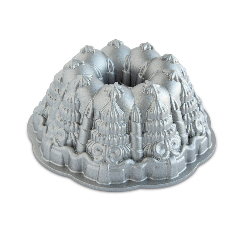 Nordic Ware | Very Merry Bundt® Pan featuring intricate holiday designs, perfect for creating stunning centerpiece cakes with even baking and easy release.