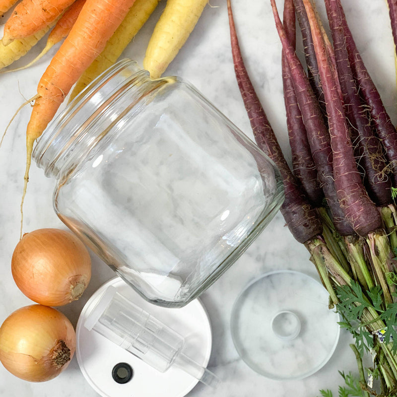 FarmSteady - Fermented Vegetable Kit featuring a glass jar with vegetables, airlock lid, and fermentation weight for easy, healthy lacto-fermentation.