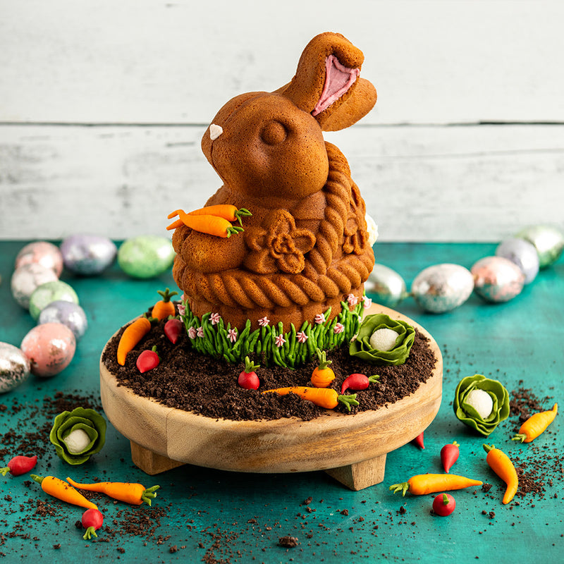 Nordic Ware | Bunny In Basket 3D Cake Pan showcasing a bunny-shaped cake, perfect for Easter gatherings, highlighting its intricate design and baking capabilities.