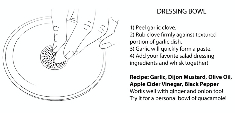 Hand holding RachaelPots Salad Dressing Bowl with integrated garlic scraper, illustrating its multifunctional design for making dressings, marinades, or guacamole effortlessly.