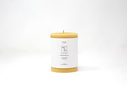 Mo&Co Home - 100% Beeswax Pillar Candle: 3x4 Inch, featuring a white label with black text, highlighting sustainable, eco-friendly design for clean burning.