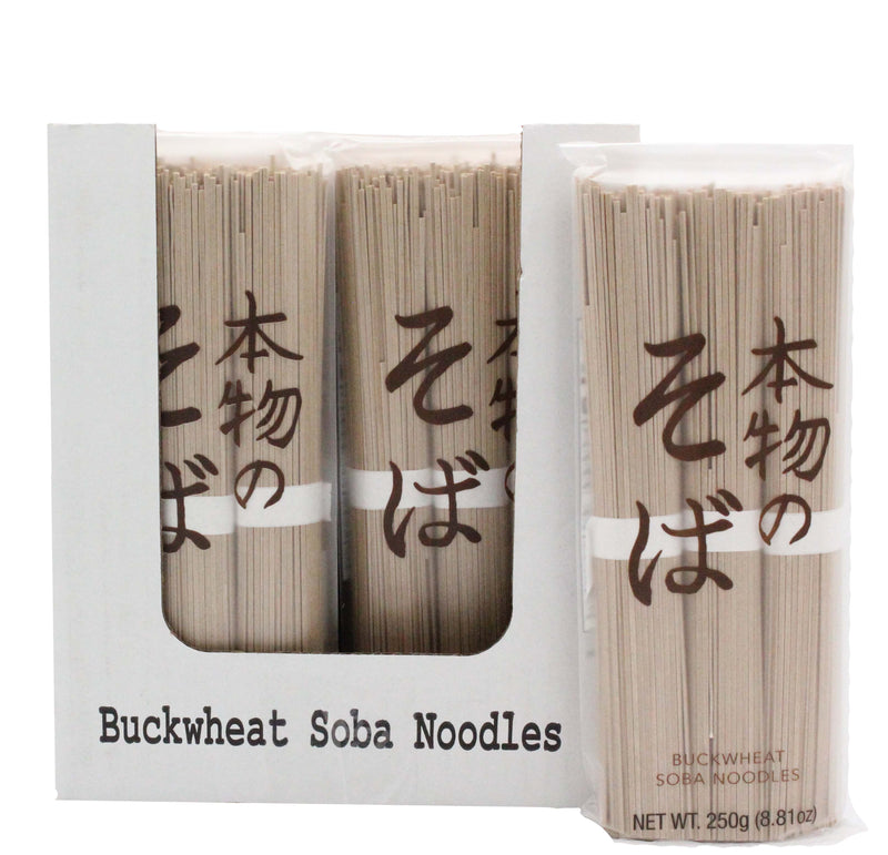 Mikuni Wild Harvest USA - Buckwheat Soba Noodles, 250g: Bundles of uncooked noodles in clear packaging with Japanese text, displayed in a labeled white tray.