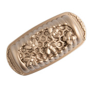 Nordic Ware | Honey Hive Loaf Pan with bee and honeycomb design, perfect for baking detailed loaves, available at Athens Cooks kitchen store.