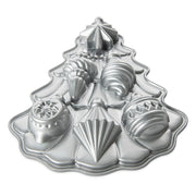 Nordic Ware Vintage Ornament Cakelet Pan, a silver Christmas tree-shaped mold, perfect for crafting festive, intricate holiday desserts with ease and elegance.