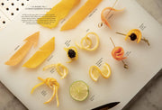 Penguin Random House LLC - The Bartender's Manifesto poster showcasing various citrus garnish styles on a cutting board, highlighting cocktail artistry for Athens Cooks' discerning customers.