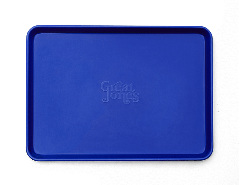 Great Jones | Holy Sheet - Broccoli: A versatile half-sized sheet pan with nonstick ceramic coating, perfect for effortless baking and serving directly from oven to table.