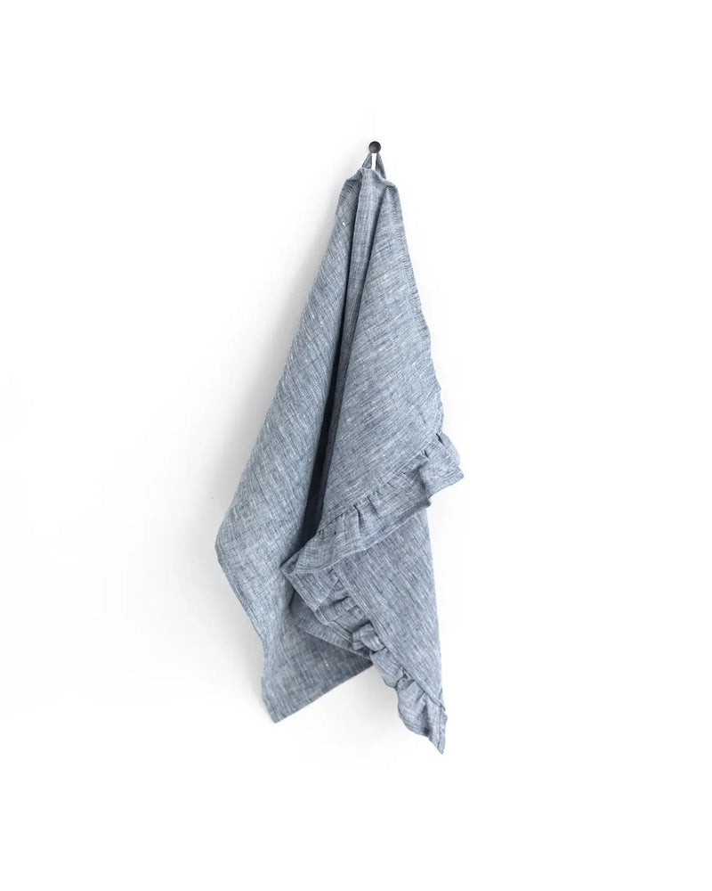 MagicLinen - Ruffle trim tea towel hanging, showcasing its durable, absorbent linen fabric with a stylish ruffle design, ideal for enhancing kitchen functionality.