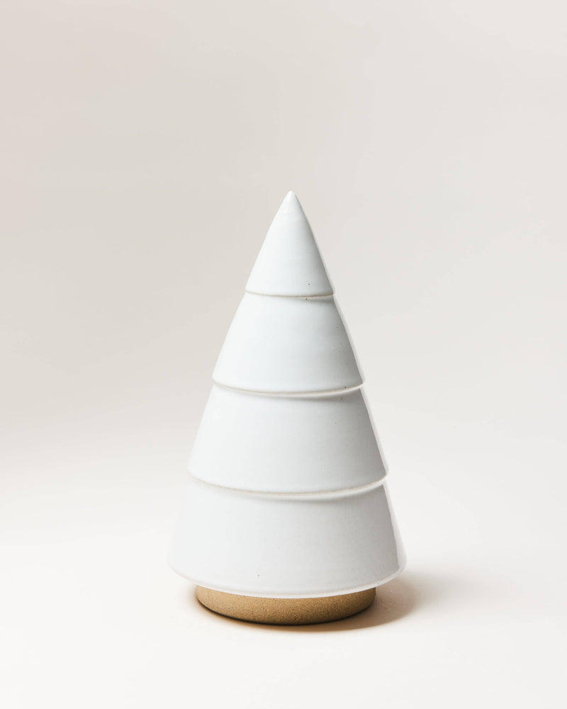 Farmhouse Pottery - Balsam Woodland Trees: Medium, a minimalist ceramic tree-shaped sculpture, perfect for year-round decor, featuring stacked, tapering cones on a tan base.