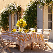Couleur Nature - Provence Avignon Dijon & Blue Tablecloth: 71 x 71 draped on a sunlit table, surrounded by wine and floral centerpieces in a Provençal courtyard setting.