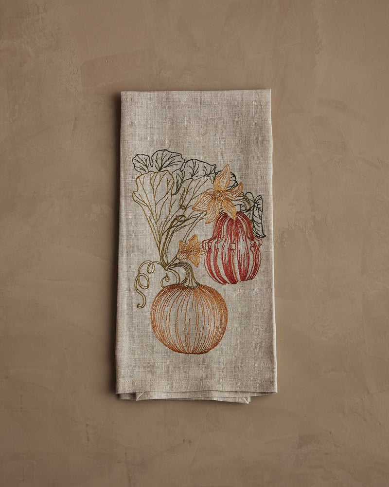 Coral & Tusk - Pumpkin Vine Tea Towel features embroidered pumpkins and vines, perfect for autumn kitchen decor. Measures 25 × 18 unfolded.