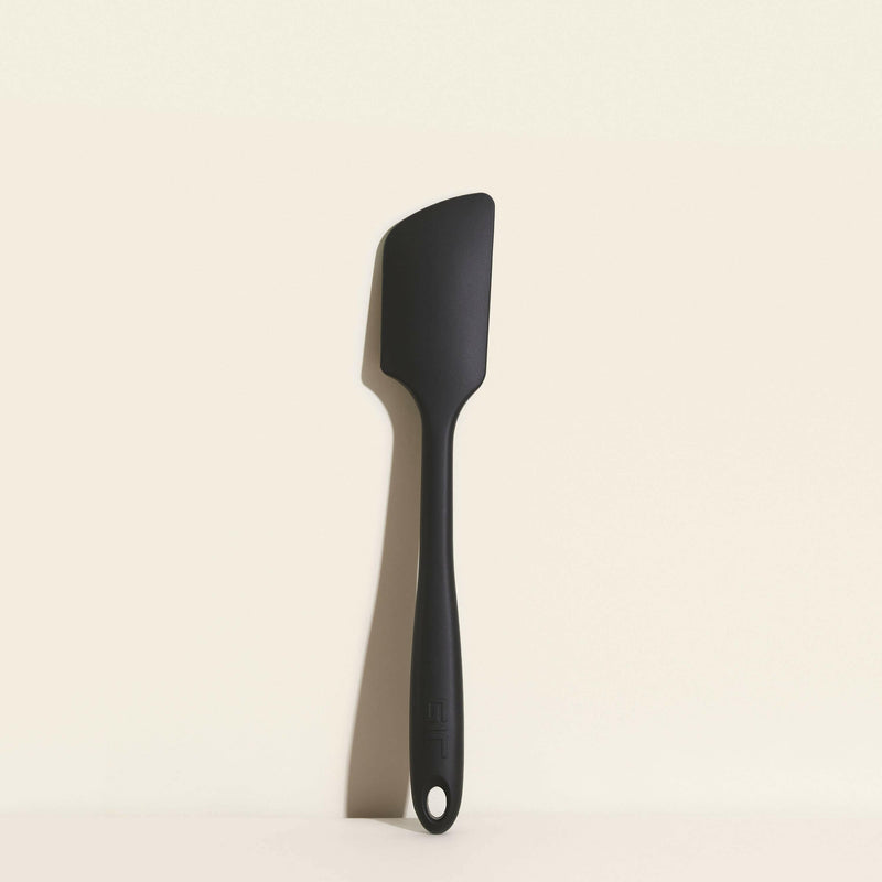 GIR | Ultimate Spatula - Navy, a versatile black spatula on a white surface, designed for precision and durability in cooking.