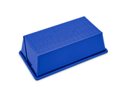 Great Jones | Breadwinner - Raspberry loaf pan with a wavy, corrugated bottom, designed for easy release and durability.