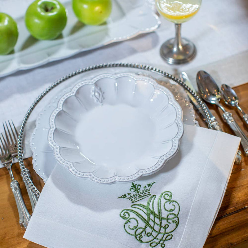 Bella Bianca Medallion Pasta/Soup Bowl on a table with silverware, featuring Italian stoneware craftsmanship, perfect for daily use with cereal, soup, or pasta.