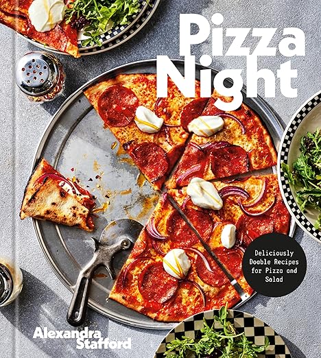 Cover of Pizza Night: Deliciously Doable Recipes for Pizza and Salad by Alexandra Stafford, featuring a pepperoni pizza, salads, and a pizza server on a metal pan.