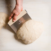 Brod & Taylor Bench Knife showcased, ideal for precise dough cutting and kitchen tasks, embodying Athens Cooks' commitment to high-quality kitchen tools and expert culinary support.