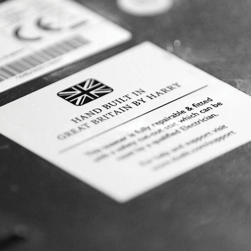 Label on Dualit 4 Slice Classic Toaster, Polished, highlighting Hand Built in Great Britain with repairability features, reflecting Athens Cooks' dedication to quality kitchen appliances.
