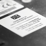 Label from a Dualit | 2 Slice Classic Toaster, Copper, highlighting its British craftsmanship, with assembler's name, emphasizing repairability and quality, reflecting Athens Cooks' curated kitchen essentials.