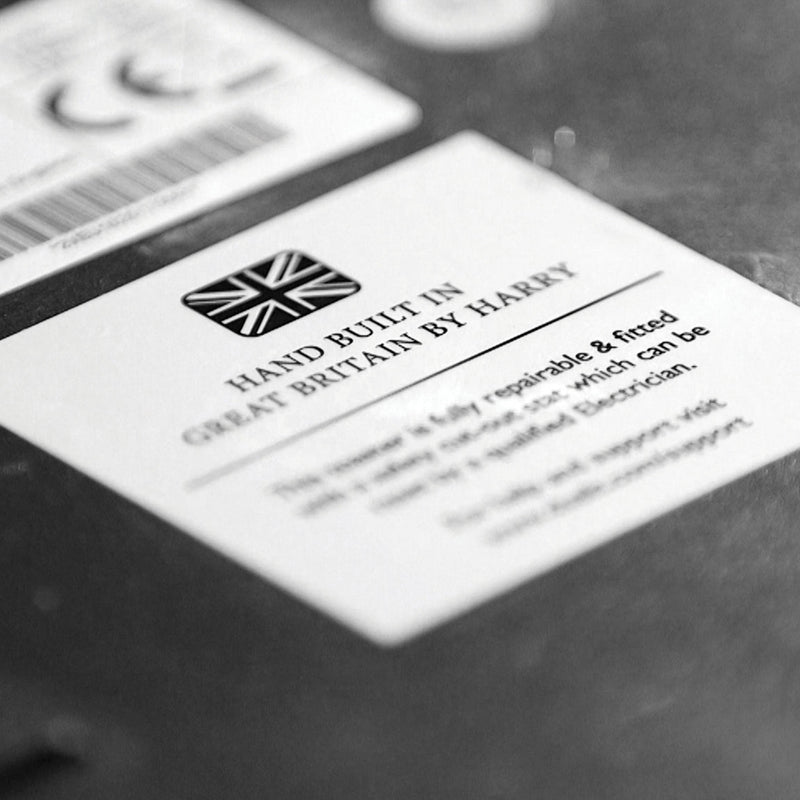 Label from a Dualit | 2 Slice Classic Toaster, Copper, highlighting its British craftsmanship, with assembler's name, emphasizing repairability and quality, reflecting Athens Cooks' curated kitchen essentials.