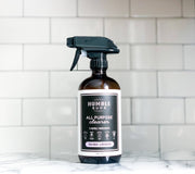 Humble Suds | All Purpose Cleaner in Refillable Glass Bottle - Tea Tree & Lavender, featuring a sprayer and logo, ideal for safe, eco-friendly cleaning.