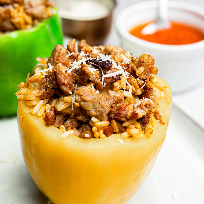 Rock House Creamery | Andouille Sausage - Ground, featured in a stuffed pepper with meat and rice, showcasing its Cajun-inspired flavor and culinary versatility.