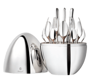 Christofle MOOD BY CHRISTOFLE 24 Pieces: A polished egg-shaped case opens to reveal a 24-piece silver-plated cutlery set, elegantly displayed for stylish dining.