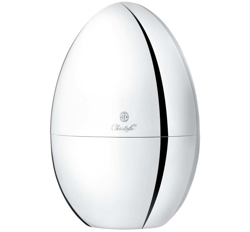 Christofle MOOD BY CHRISTOFLE 24 Pieces in a glossy egg-shaped container with logo; holds a 24-piece silver-plated flatware set for elegant dining.