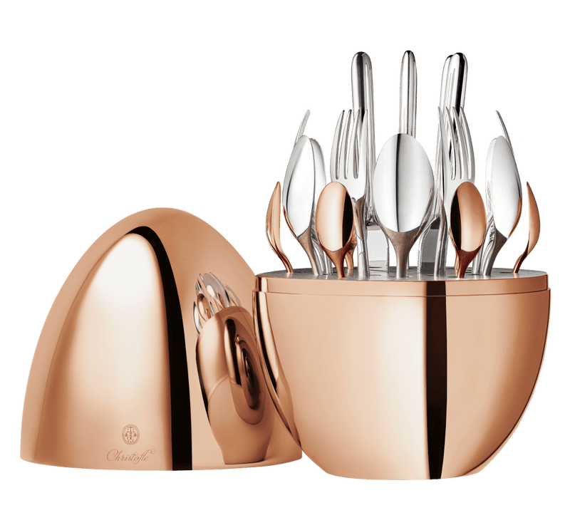 Christofle | MOOD Precious 24 Pieces: Polished egg-shaped case revealing organized cutlery set, featuring silver plate and rose gold finish, elegantly stored and displayed.