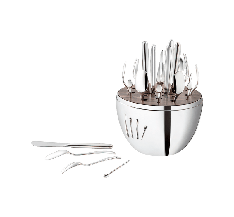 Christofle | MOOD Party 24 Pieces: Sculptural flatware set in a polished-metal caddy with knives, spoons, forks, and picks arranged vertically, showcasing contemporary entertaining elegance.