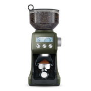 Breville | Smart Grinder Pro with clear hopper of coffee beans and digital controls, dispensing freshly ground coffee into a portafilter below.