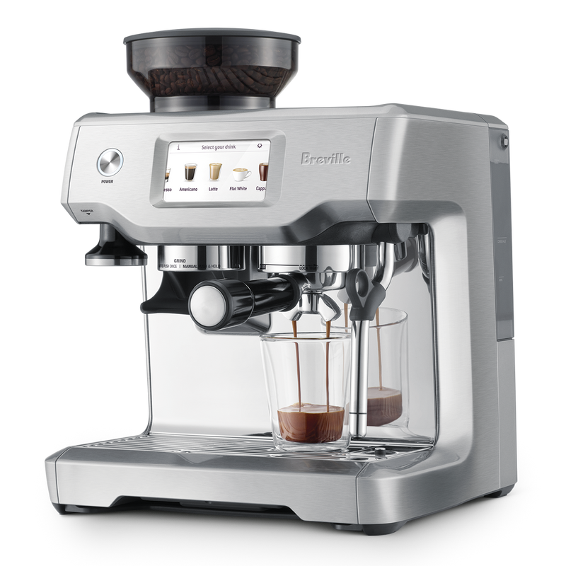 Breville | Barista Touch espresso machine with bean hopper, grinder, and touchscreen showing drink options. Features portafilter, dual-spout for espresso shots, and steam wand for milk frothing.