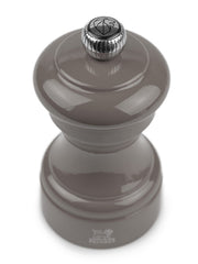 Peugeot | Bistro Pepper Mill, Smoked Grey: A manual wooden mill with adjustable metal knob for grind size, featuring a durable mechanism crafted from sustainably sourced beech.