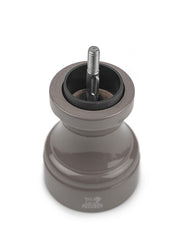 Peugeot | Bistro Pepper Mill, Smoked Grey, showcasing its exposed ceramic grinding mechanism and adjustable top button for customizing pepper coarseness.