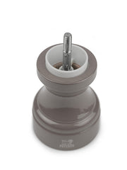 Peugeot | Bistro Salt Mill, Smoked Grey, with top removed, revealing its steel grinding mechanism, embodying the stylish essence of a French café.
